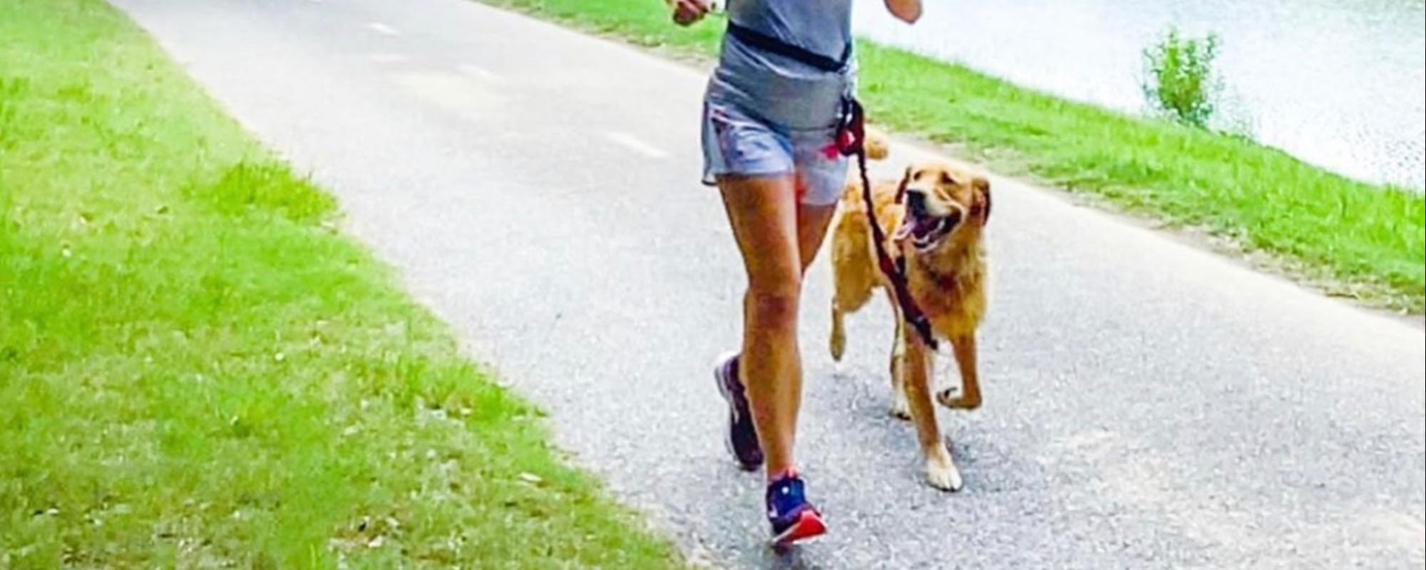 Running with dog wearing an Iron Doggy hands-free leash my a river